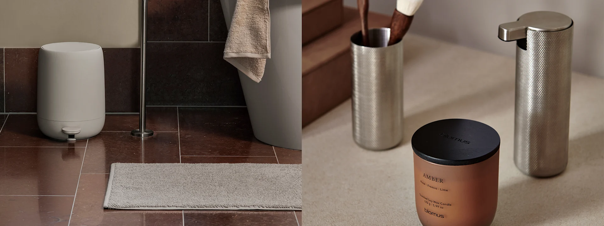 Brauner Marmor-Waschtisch mit schwarzem Wasserhahn, grauem Handtuch und schwarzen Accessoires. Ein schwarzes Regal darüber hält schwarze Flaschen. Rechts eine Kupkerze und silberne Spender.