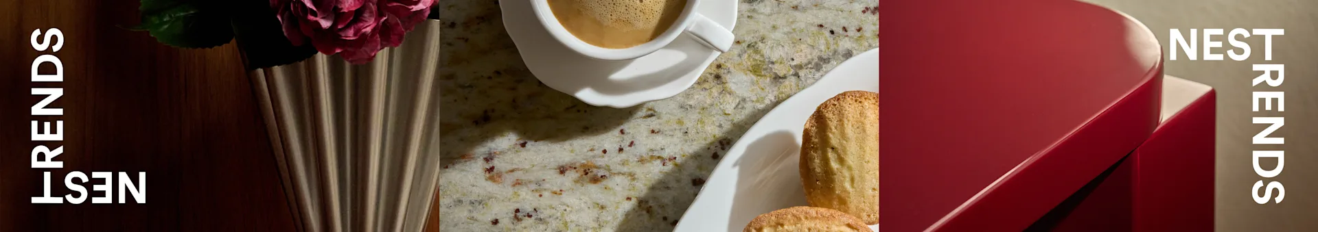 Kaffeetasse, Madeleines und Rose in geriffelter Vase auf gesprenkelter Arbeitsplatte neben roter Box mit 'NEST TRENDS'.