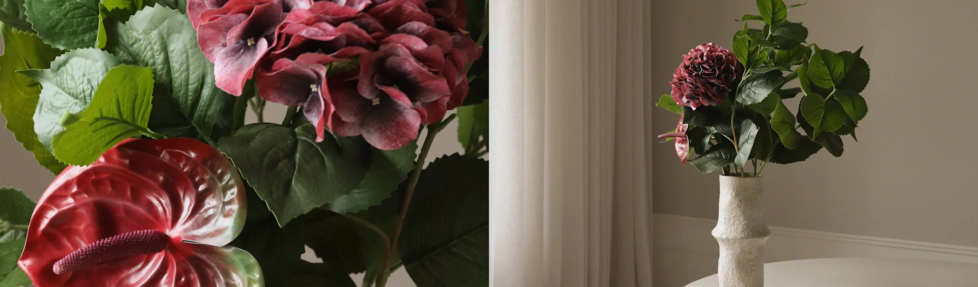 Künstliche dunkelrote Hortensie und rote Anthuriumblüten in einer strukturierten weißen Vase.